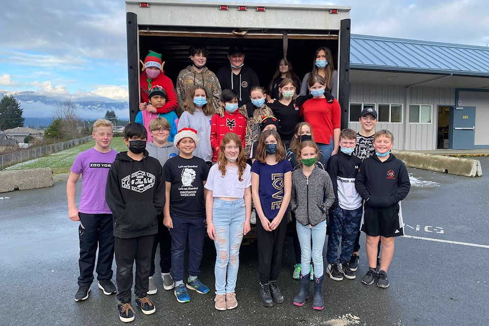 Students and staff from Maquinna Elementary School in Port Alberni fill a truck with more than 1,100 items that were donated to the Salvation Army to help families in the community. (PHOTO COURTESY MAQUINNA ELEMENTARY)