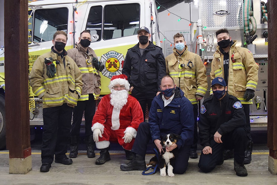 Members of the Beaver Creek Volunteer Fire Department (and Santa) pose for a photo during their food drive on Sunday, Dec. 19. (ELENA RARDON / ALBERNI VALLEY NEWS)