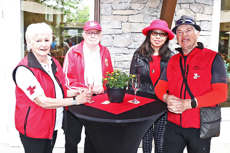 Volunteer swimming sport coordinators Donna Tyrrell, husband Dan Tyrrell, Wei Xiao and horseshoes coordinator Bob McCauley help celebrate the countdown to Greater Victoria’s 55-Plus BC Games, at Berwick Royal Oak on June 7.
