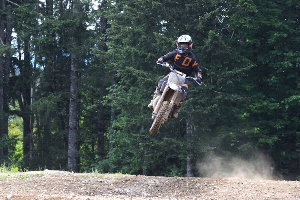 A young motocross racer catches some air during racing action at the Cold Creek track in Port Alberni. (ELENA RARDON / ALBERNI VALLEY NEWS)