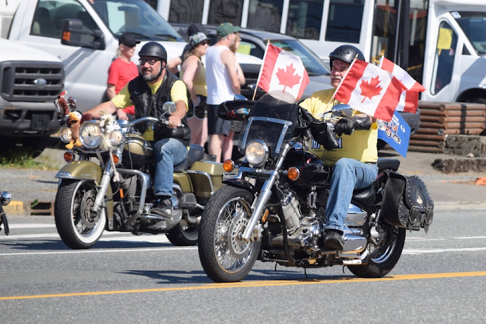 David Wiwchar and Len Bodaly from Port Alberni Toy Run participate in the Canada Day parade on July 1, 2022. (ELENA RARDON/ Alberni Valley News)