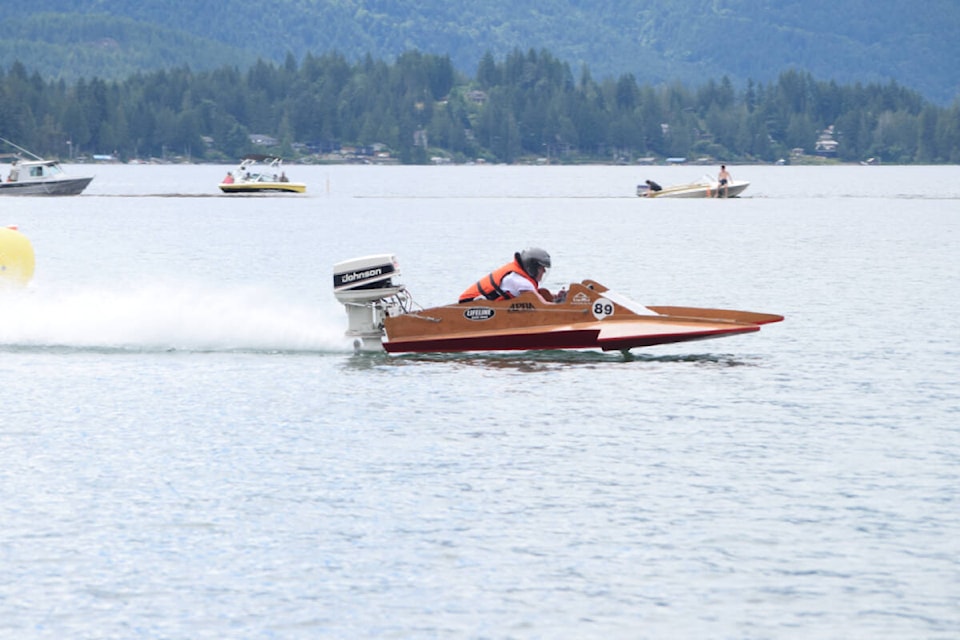 A racer takes a lap around Sproat Lake during the regatta on Sunday, July 10. (ELENA RARDON / ALBERNI VALLEY NEWS)