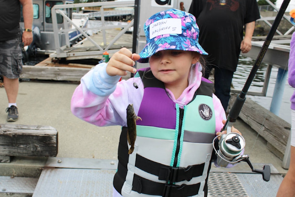 Jaedyn Waldriff, age eight, proudly holds her catch. (SONJA DRINKWATER / Special to the News)