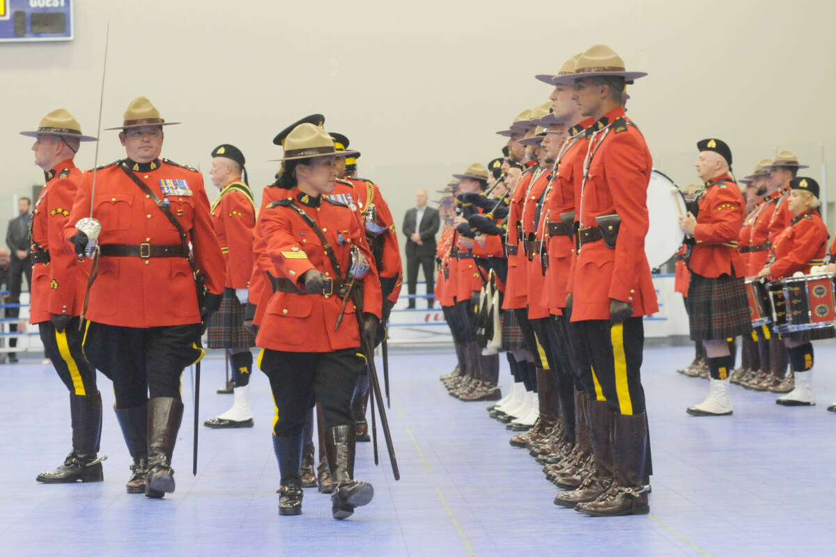 Retiring Deputy Commissioner Jennifer Strachan conducted her final inspection, of the assembled officers in the Langley Events Centre hall Tuesday, Sept. 20 . (Dan Ferguson/Langley Advance Times)
