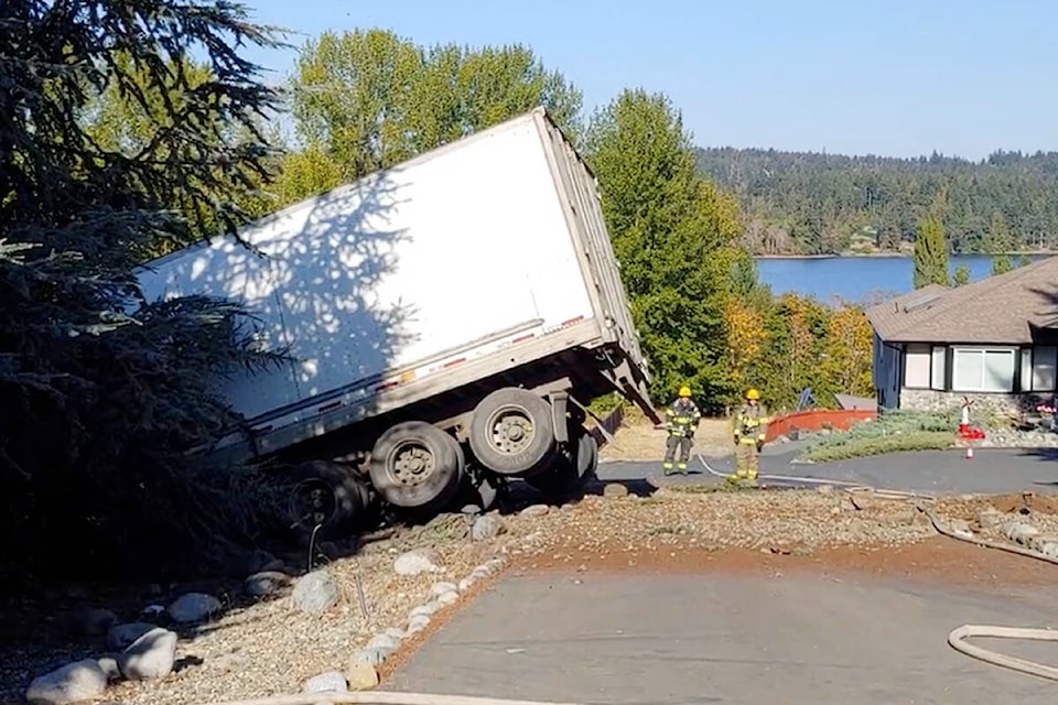 30586805_web1_221005-NBU-crash-nanoose-truck-into-house-1_1