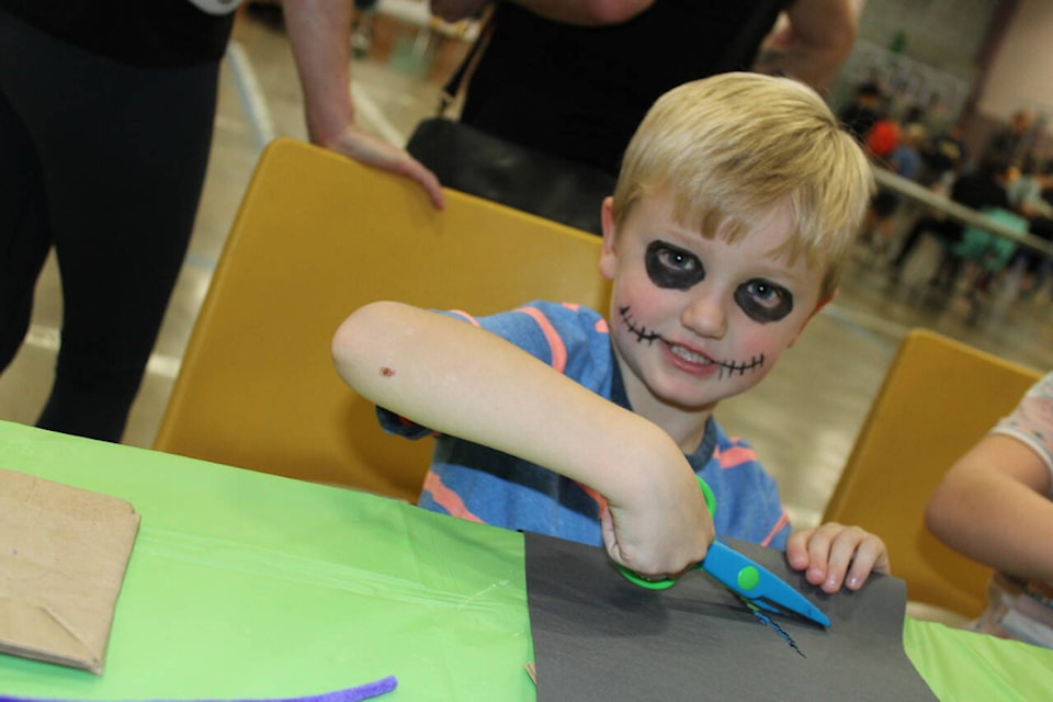 Jack McDonell, age four, had fun making a craft after having his face painted. (SONJA DRINKWATER / SPECIAL TO THE NEWS)