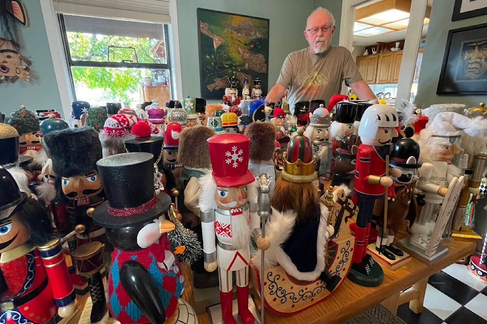 Kenn Whiteman of Port Alberni stands behind a table full of nutcrackers—only a fraction of his 260-piece collection. (SUSAN QUINN/ Alberni Valley News)