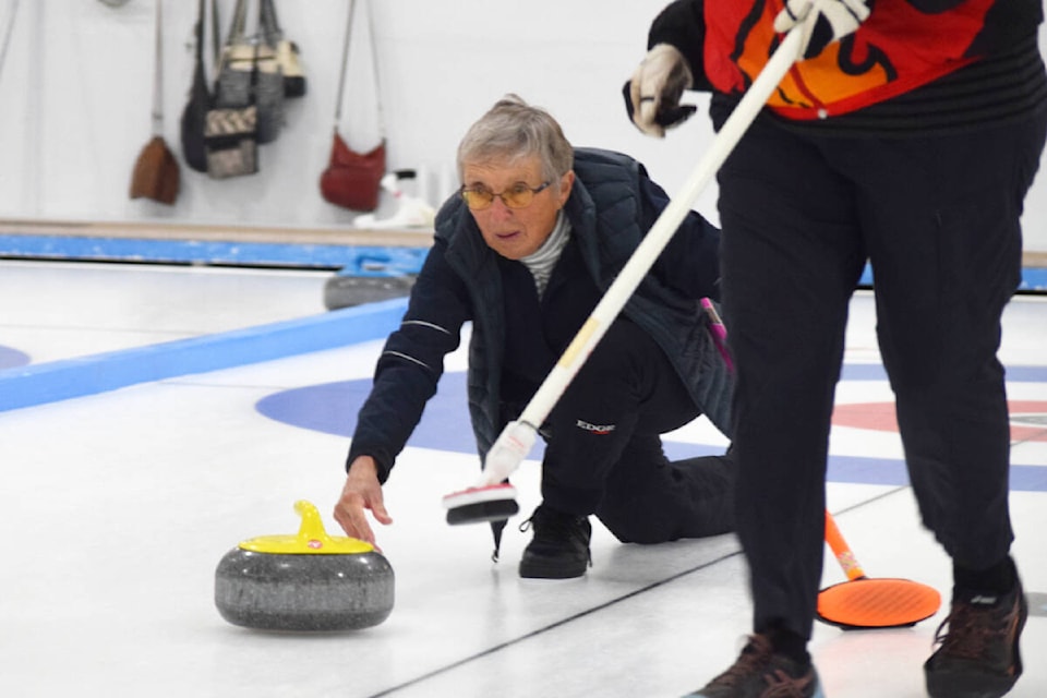 Lorraine Jeffries from Team Jefferies curls during the “B” event final on Sunday, Nov. 20. (ELENA RARDON / ALBERNI VALLEY NEWS)