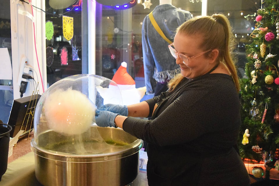 Kyra Doskotch of Cotton Candy Alberni serves up cotton candy at Witchy Woman Supply Co. during Moonlight Madness in Port Alberni’s Uptown on Wednesday, Nov. 23. (ELENA RARDON / ALBERNI VALLEY NEWS)