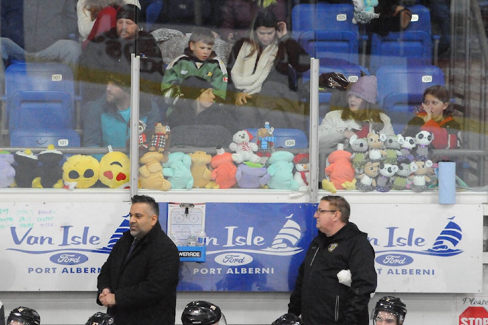 Alberni Valley Bulldogs’ fans line up their stuffies on the glass behind the Victoria Grizzlies in anticipation of the Bulldogs scoring their first goal for the teddy bear toss on Friday, Dec. 2, 2022. The Grizzlies foiled their plans, however, by shutting out the Bulldogs’ 5-0. (SUSAN QUINN/ Alberni Valley News)