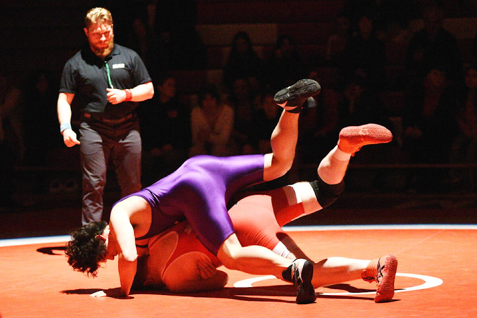 Jude Yee Fung from Vancouver College attempts to pin ADSS wrestler Grant Coulthart in the heavyweight match of the McEvay Post dual meet to kick off the 42nd Alberni Invitational wrestling tournament, Friday, Feb. 3, 2023. (SUSAN QUINN/ Alberni Valley News)