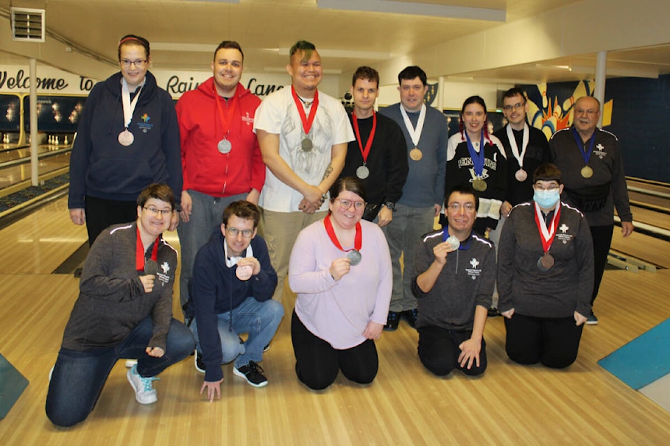 Port Alberni athletes celebrate their Special Olympics BC Winter Games medals. Standing left to right are Sarah Riddalls, Sebastien Thomas, Dakota Tate, Cody Booth, Brad Cue, Cheyenne Jokinen, Tyler VanKooten, Maurice Bernier. Front row left to right are. Jenna Domovich, Michael Booth, Kari Trott, Chris Malboeuf, and Crystal Domovich. (SONJA DRINKWATER / SPECIAL TO THE NEWS)