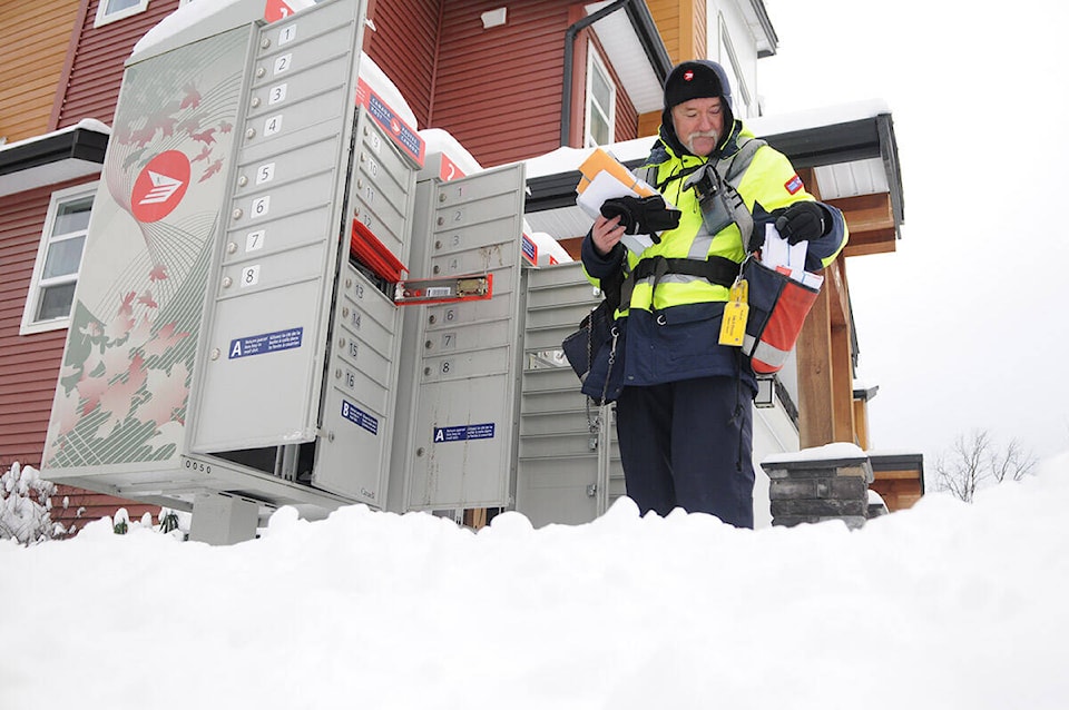 31951541_web1_220107-CPL-CanadaPost-delivery-delayed-freezingrain-Canada-Post-Carrier_1