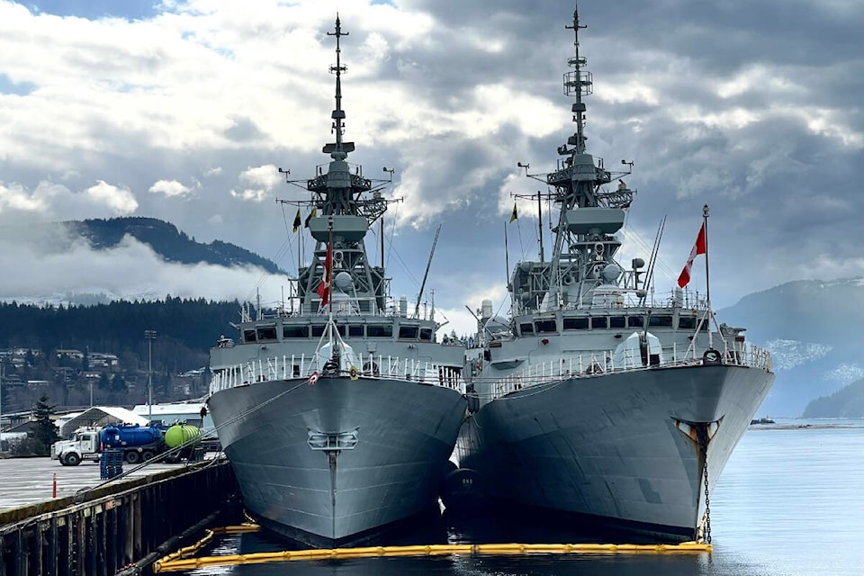 The Canadian Navy frigates HMCS Ottawa, left, and HMCS Winnipeg are docked at San Terminals Berth 3 on Wednesday, March 8, 2023 during a three-day stay in the deepsea port. Trucks from GFL Environmental can be seen on the wharf as the ships offload grey water. (SUSAN QUINN/ Alberni Valley News)