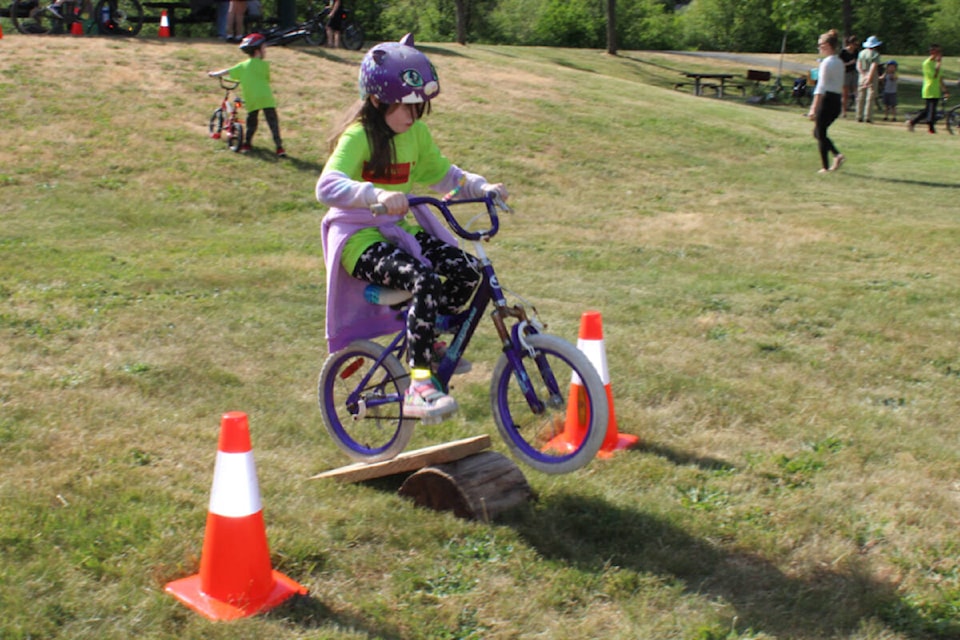 Ariana Tourangeau, 8, had fun running the bike course at Blair Park for GoByBike Week on Saturday, June 3. (SONJA DRINKWATER / Special to the AV News)