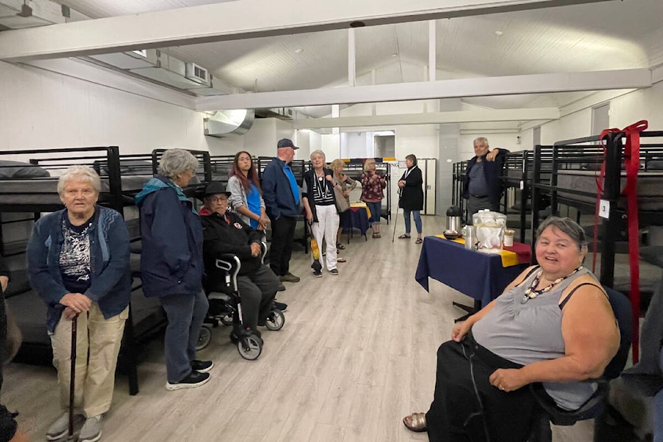 People gather in the new Bread of Life Shelter space prior to the official ribbon cutting on Friday, June 9, 2023. The shelter features 25 beds to give some of Port Alberni’s vulnerable people a place to sleep. (SUSAN QUINN/ Alberni Valley News)