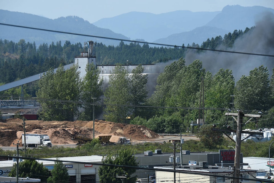 Thick, black smoke emanates from a fire at a barge full of hog fuel at Paper Excellence’s Catalyst Paper Mill in Port Alberni on Friday, July 7, 2023. (SUSAN QUINN/ Alberni Valley News)