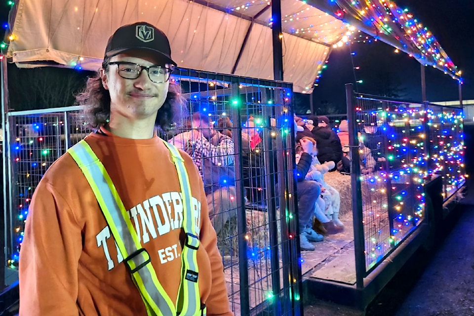 Guests are brought to the market area by a festive wagon at tbird's Christmas event. (Kyler Emerson/Aldergrove Star)