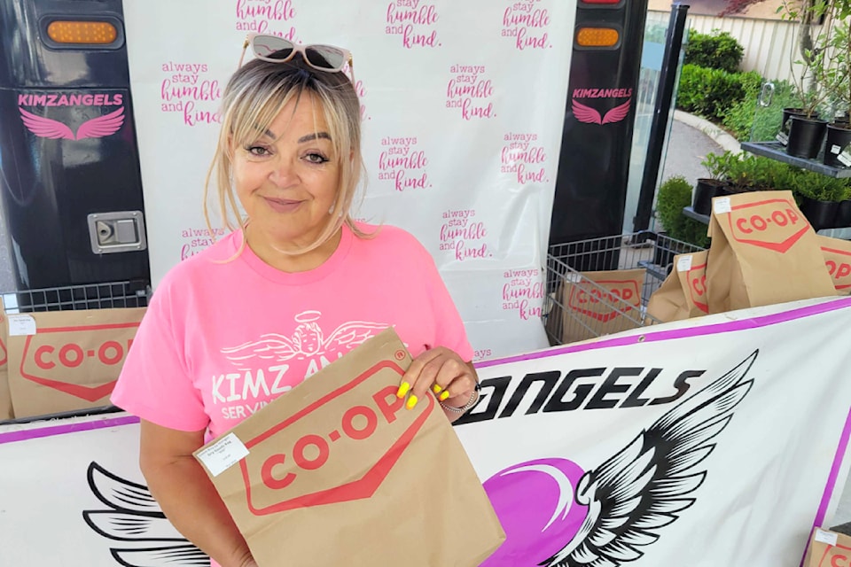 Kim Snow was accepting donations at the Otter Co-op in Aldergrove for the second annual Fill the Ambulance food drive. She will be at IGA in Murrayville next on Saturday, June 15. (Kyler Emerson/Aldergrove Star)