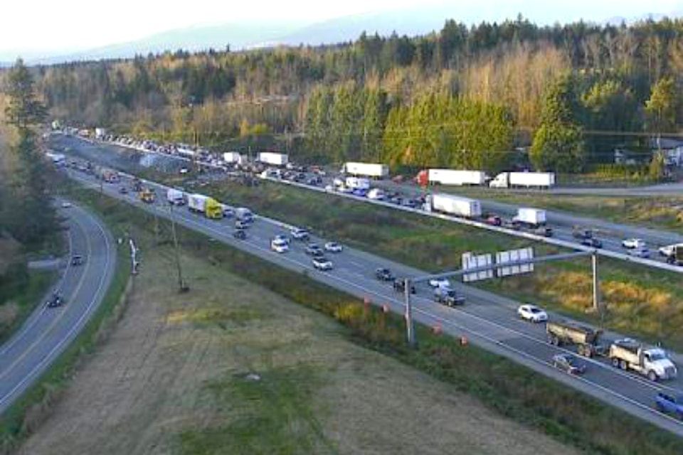 Traffic is backed up on Highway 1 after two semis hit each other in the area of 248 Street. 