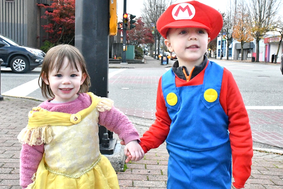 Dawn, 2, and her friend Charlie, 3, trick-or-treated in downtown Aldergrove on Oct. 31. (Kyler Emerson/Aldergrove Star)