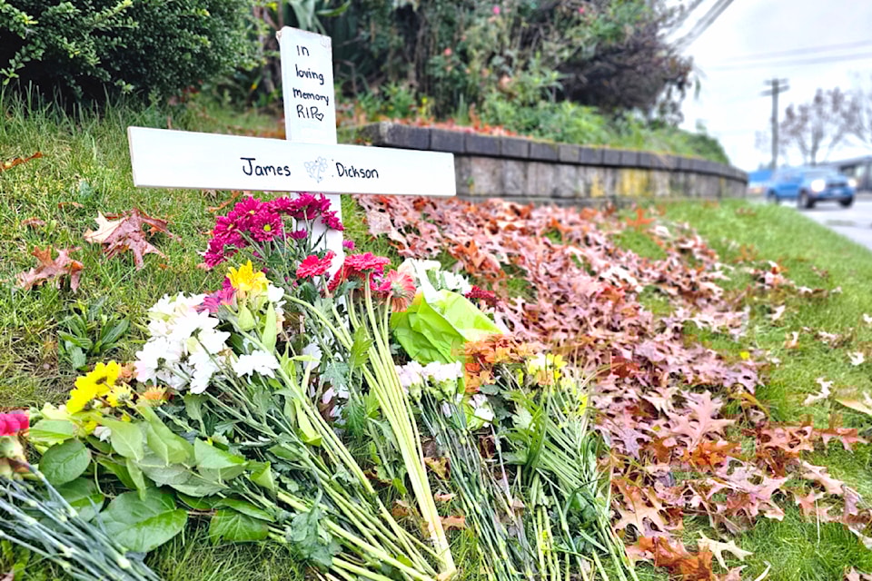 A memorial was placed at Fraser Highway and 264 Street for James Dickson, 19, who succumbed to his injuries after being struck by a dump truck in Aldergrove on Monday, Nov. 4. (Dan Ferguson/Black Press Media)