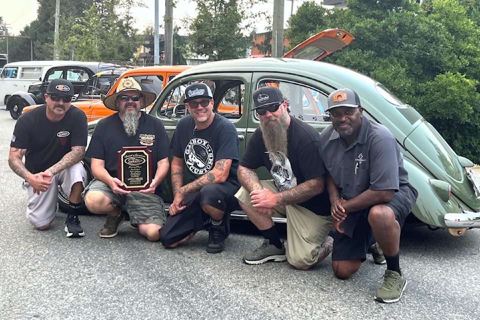 Rob Clough (second from left) was awarded the Jimmy Shine award by Tony Walcott (far right) at the 25th annual Cruise-In car show. (Special to The Star)