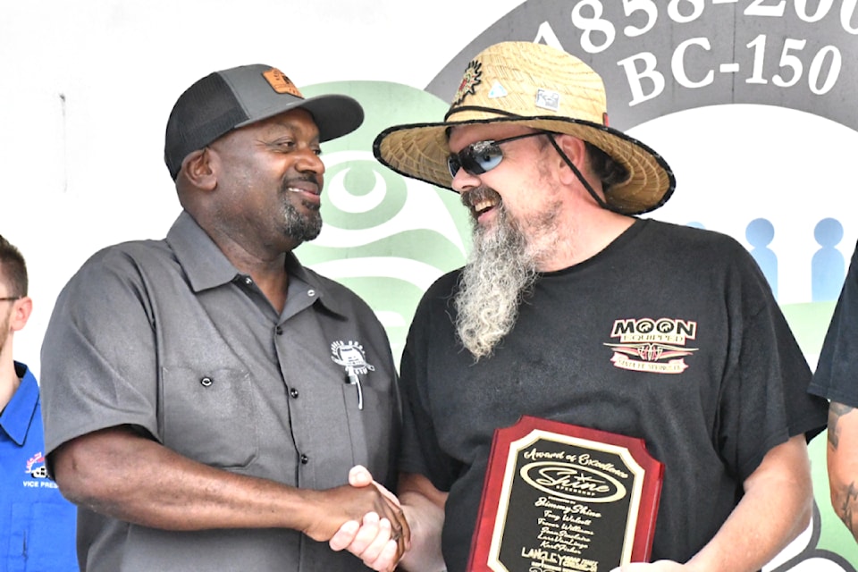 Rob Clough was awarded the Jimmy Shine award by last year's winner Tony Walcott on Saturday, Sept. 7 at the Cruise-In. (Kyler Emerson/Aldergrove Star)