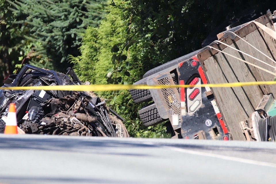 Fatal collision between a semi truck and a car has killed one and closed the intersection of 256 St. and 56 Ave. on the morning of Monday, Aug. 11. 