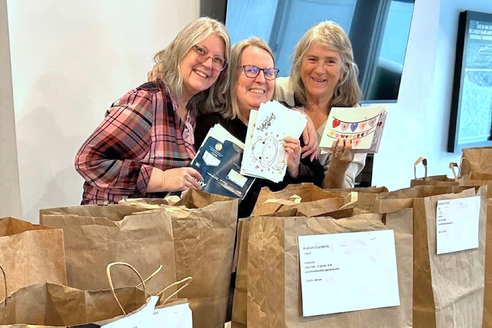 91ԭ Volunteers sortedmore than 2,600 personalized Valentine's Day cards made by local students for seniors. (Special to The Star)