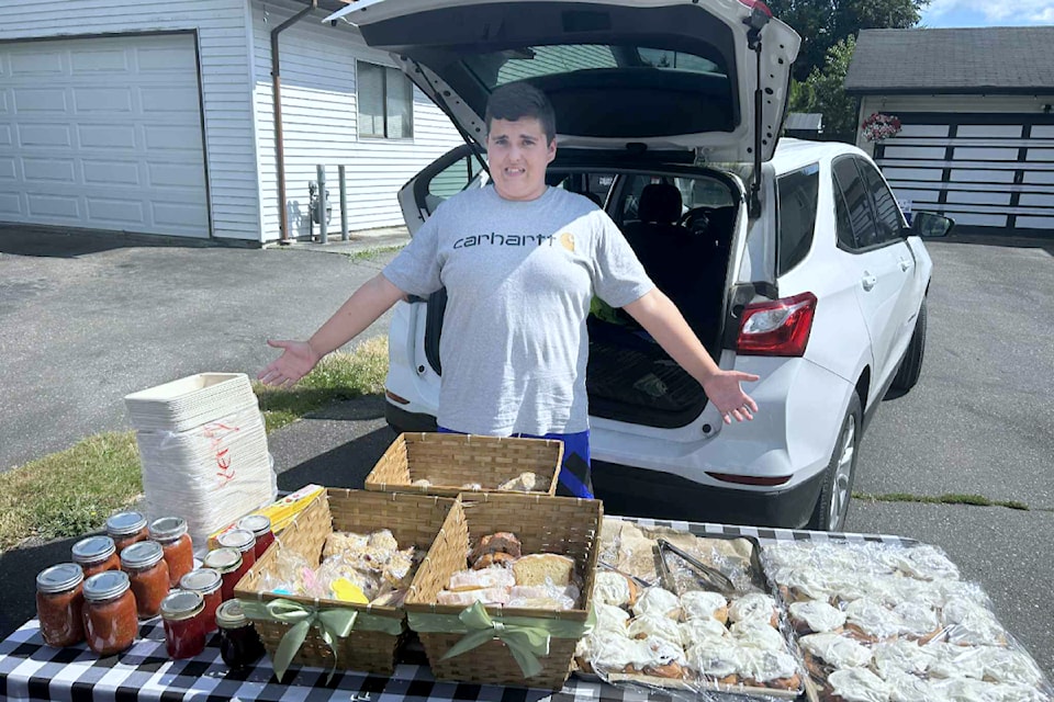 Young boy at his market stand