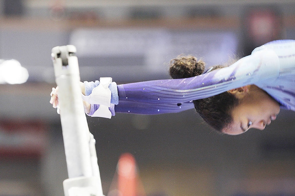 9637363_web1_171202-LAT-Langley-Gymnastics-tournament-competitor-close-up