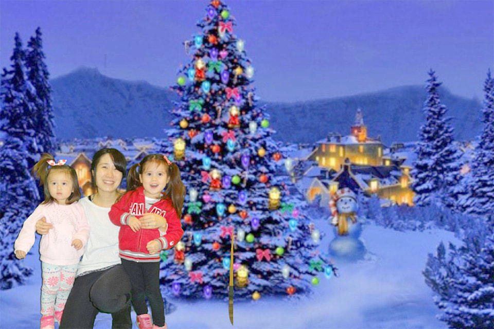 People who get photos in front of the green screen at the holiday fun event on Dec. 12 will have their photos emailed to them by library staff. (Library photo)