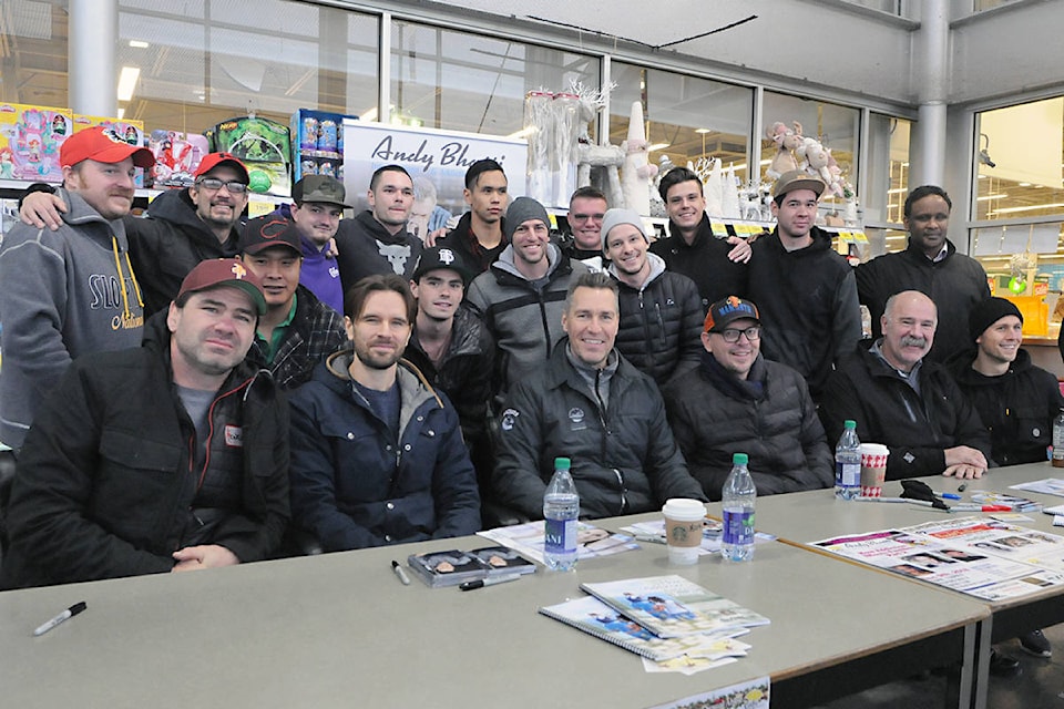 Members of a recovery program, who agreed their picture could appear in the newspaper, posed with celebrities at the Celebrity Food Drive in 2018. (Black Press Media files)