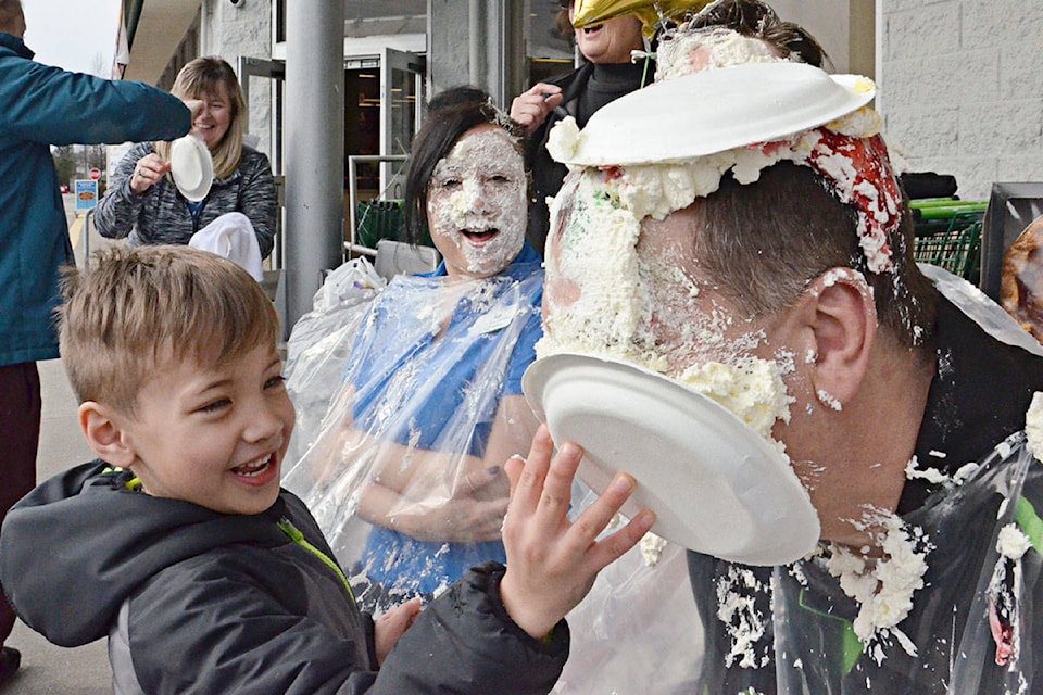 Jamie Rhodes delighted in planting a pie on the face of Kevin Young at a special fundraiser Thursday, March 14 at the Save-On-Foods in Langley City. (Heather Colpitts/Langley Advance Times)