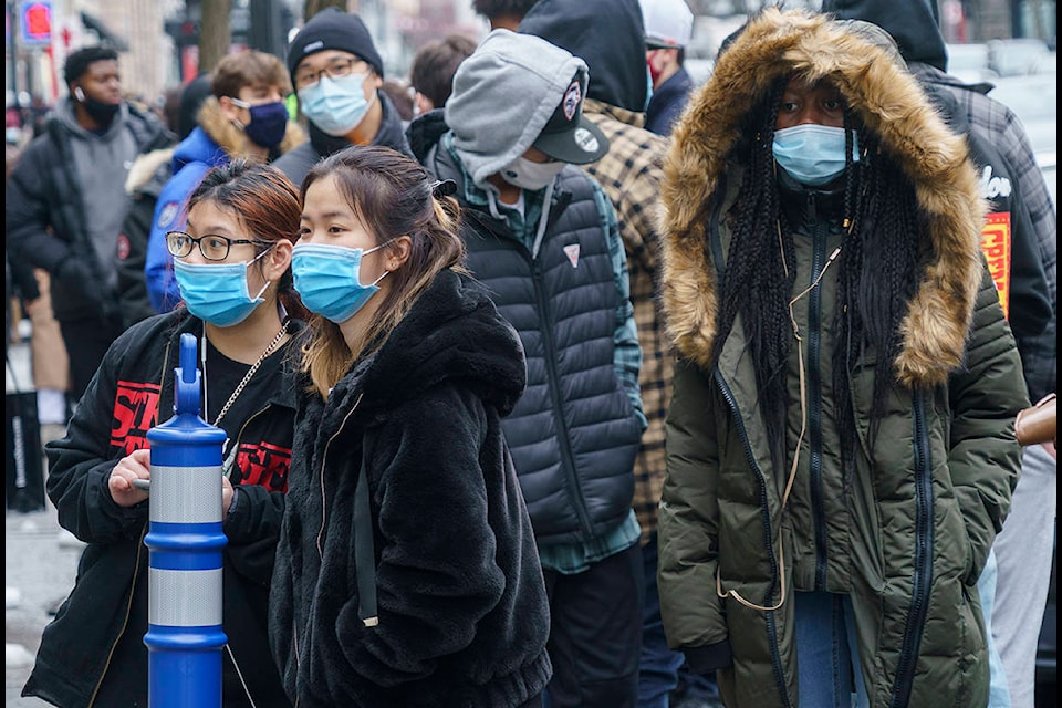 Shoppers line up in front of a shop on Montreal’s Saint-Catherine Street in search of Black Friday deals in Montreal, Friday, Nov. 27, 2020. THE CANADIAN PRESS/Paul Chiasson