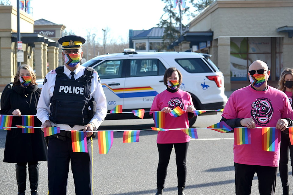 Langley RCMP officers and Langley School District employees marked a rainbow crosswalk at 48A Avenue and 222 Street on Wednesday, Feb. 24, for Pink Shirt Day. (Ryan Uytdewilligen/Aldergrove Star)