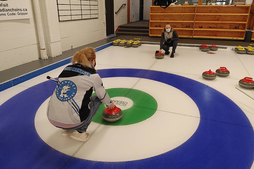 24398221_web1_210302-LAT-Curling-during-pandemic-practice_1