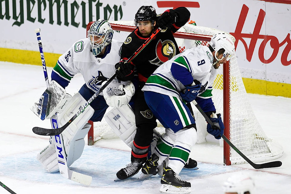 24711435_web1_210331-CPW-Canucks-Flames-demko_1