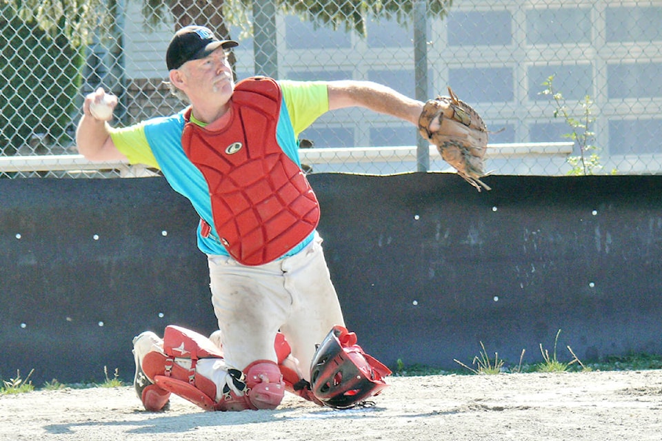 Catcher Howard Sandrel helped organize a new league for baseball players 60 and older launched at Langley’s City Park on Sunday, Aug. 15. It is believed to be the first of its kind in the Lower Mainland.(Dan Ferguson/Langley Advance Times)