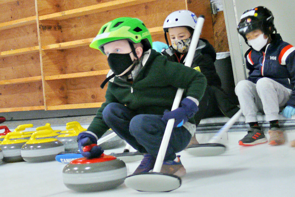 A Canadian Tire Jumpstart grant has purchased new light-weight, but full-size, curling stones for the Langley Curling centre Little Rock program for kids, seen here practicing on Saturday, Oct. 16. (Dan Ferguson/Langley Advance Times)