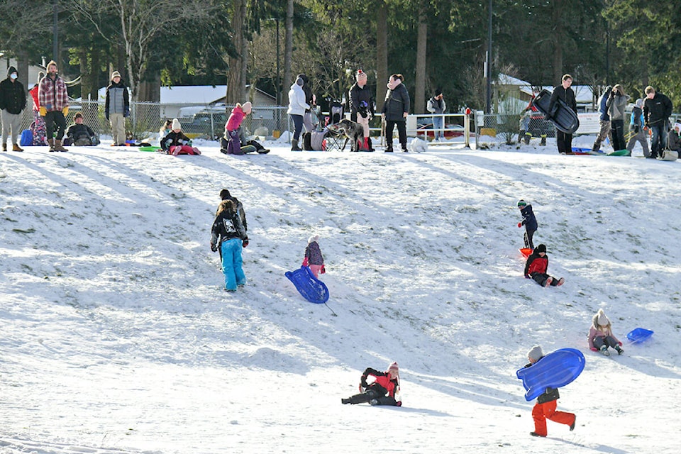 The slope near George Preston recreation centre was busy with sleds and toboggans on Monday, the day temperatures fell to a record low. (Dan Ferguson/Langley Advance Times)