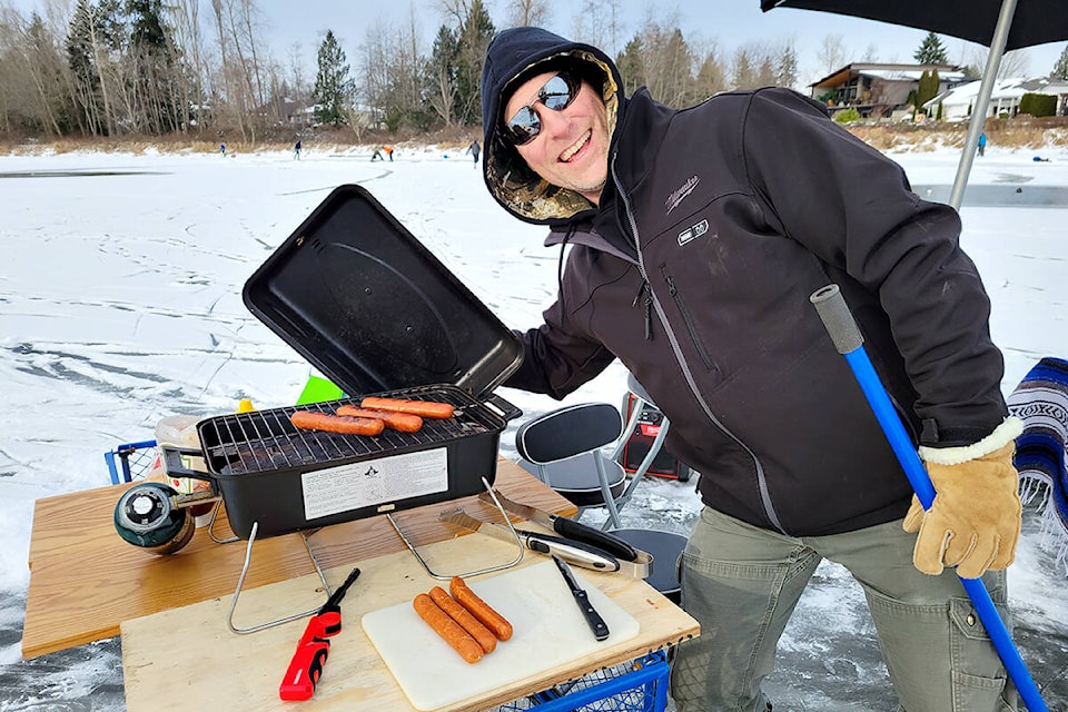 Roger Schmidt set up his barbecue on the frozen surface of Brydon Lagoon on Wednesday, Dec. 29. (Dan Ferguson/Langley Advance Times)