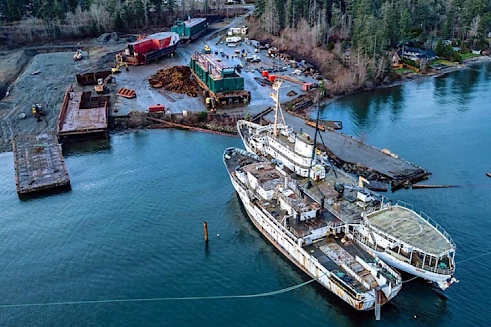 The Concerned Citizens of Baynes Sound included this photo of two ships parked in Union Bay in a presentation to the Electoral Area Services Committee. The photo shows the shipbreaking occurring on the water, which CCOBS said violates the Ministry of Forests (FLNR) foreshore lease. Photo supplied