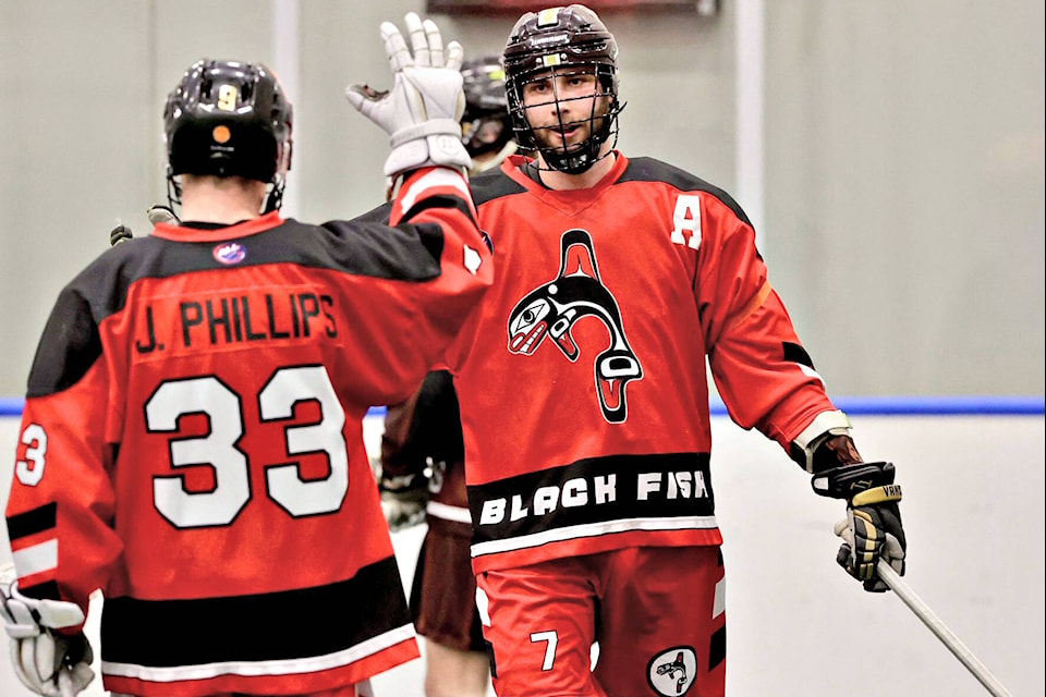 Black Fish Isaac Bot celebrates a goal with teammate Jon Phillips. A late scoring blizzard by the Grizzlies produced an 11-9 win on Saturday afternoon, Jan. 29, in week seven action of the Arena Lacrosse League West Division at Langley Events Centre. (Gary Ahuja, Langley Events Centre/Special to Langley Advance Times)