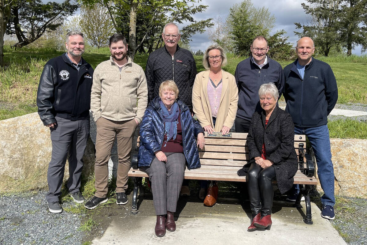 A group gathered at the Otter Co-op Pavilion on Saturday, May 7, to dedicate a memorial bench to Brian Thomasson, remembered as a huge community contributor. (Left to right) Jack Nicholson (CEO), Jon Plett (Director), Charlie Fox (Director), Shannon Todd Booth (Director), Ian Elliott (Director), Darwin Osarchuk (Director) (Special to Langley Advance Times) Sitting: Laurie Thomasson (Brians wife), Angie McDougall ( Board President) (Special to Langley Advance Times)