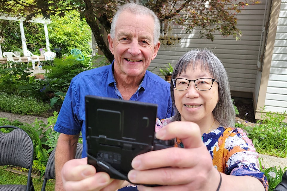 Dr Elaine Mah, chair of the LMH Heritage Committee, took a selfie with retired Dr. Ron Matthews on Saturday, May 28 at Michaud House in Langley City during the ‘Spring Tea’ fundraiser for retired medical professionals. (Dan Ferguson/Langley Advance Times)