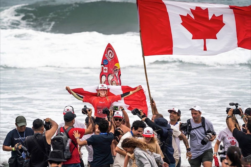 Erin Brooks is carried out of the surf after winning the Girls U-16 Final on June 5. (Sean Evans / ISA photo)