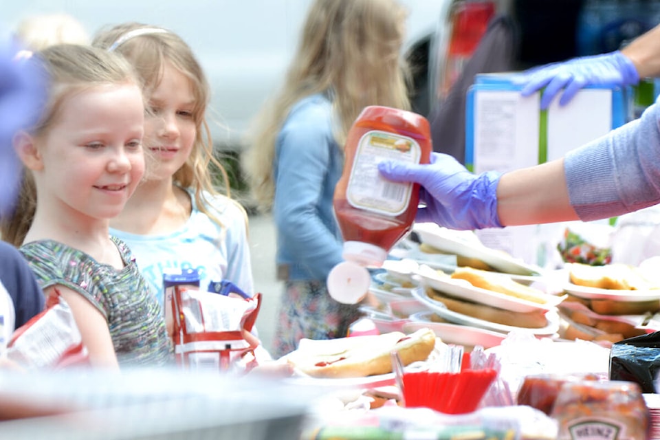 Students of Alice Brown Elementary School enjoyed hot dogs and drinks with Langley City and Township of Langley firefighters on Wednesday June 22. (Tanmay Ahluwalia/Langley Advance Times)