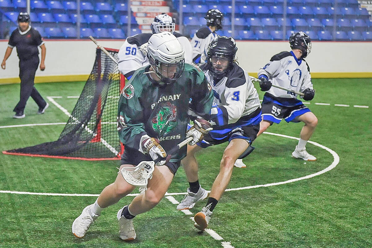 Langleys Connor Sande defended against a Burnaby Lakers player during BC Junior Tier 1 Lacrosse League action on June 28. The Lakers won this game 12-9 and the two teams will wrap up the regular season on July 3 in Burnaby. (Ryan Molag, Langley Events Centre photo)